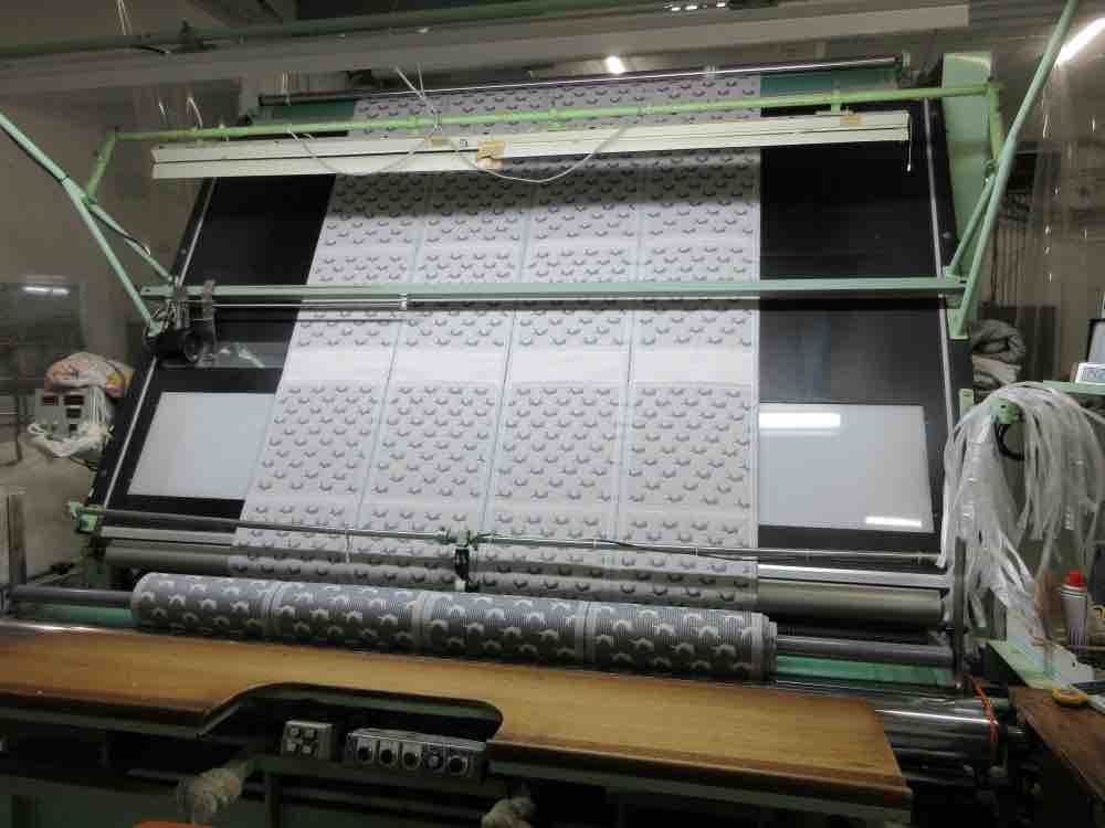 A jacquard loom weaving a pattern